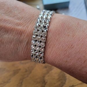 NWT TOUCHSTONE BY SWAROVSKI ADJUSTABLE SILVER BRACELET..IN BOX NEVER WORN.